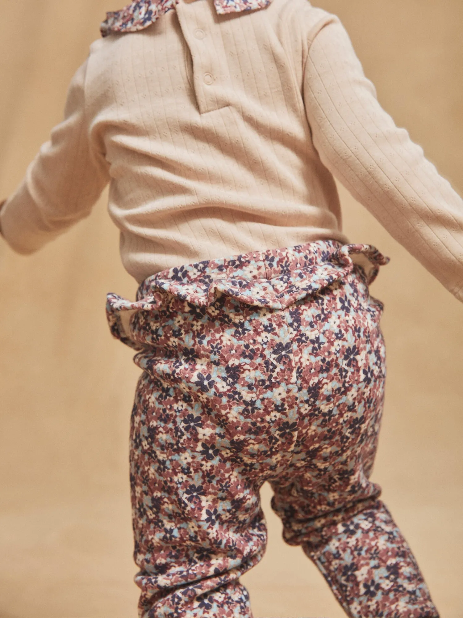 Legging beige à imprimé fleuri